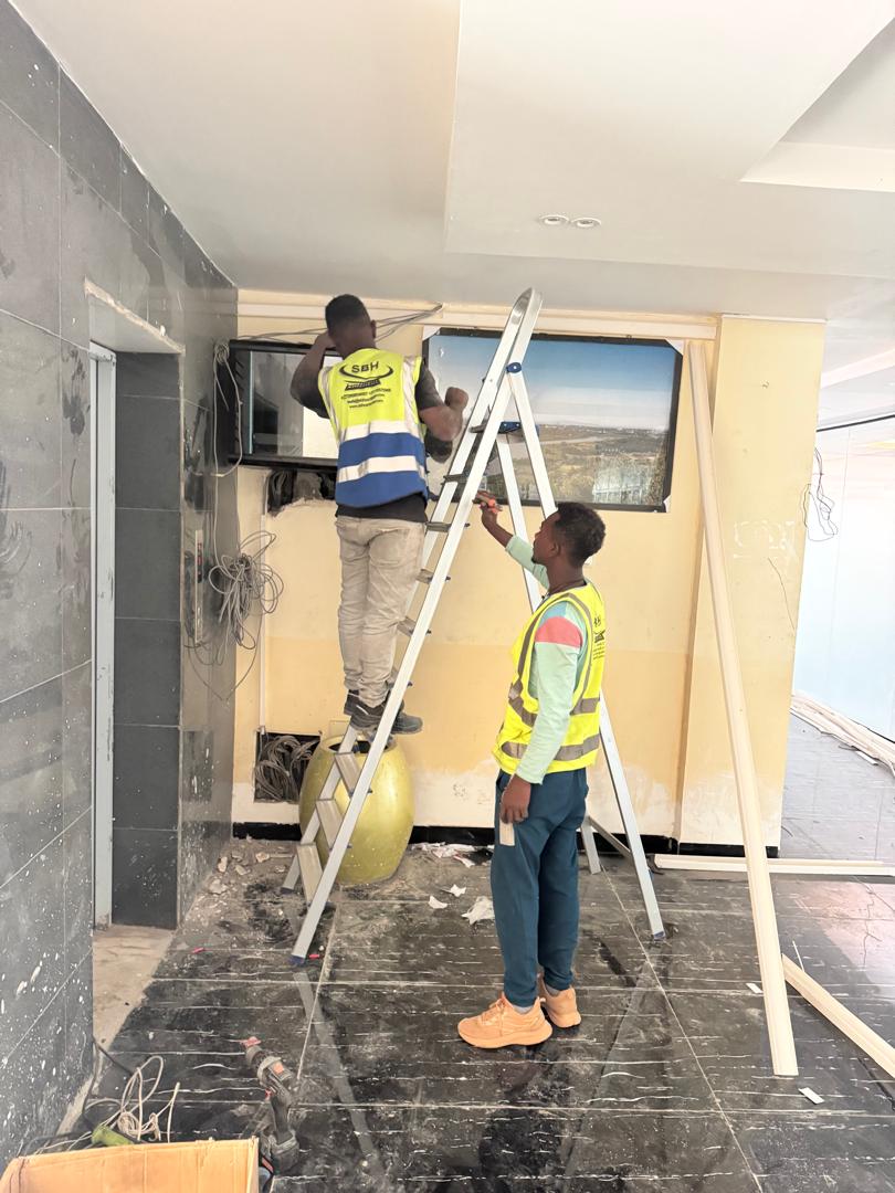 SBH technicians installing network equipment on-site