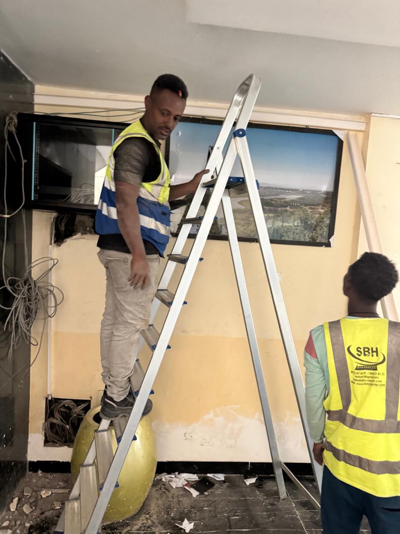 SBH team members working on cabling and network setup